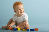 1890092 Redheaded Baby Playing With Blocks